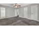 Spacious bedroom features neutral walls, carpet flooring, ceiling fan, and closet doors at 3189 Glen Hollow Dr, Rex, GA 30273