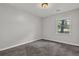 Bedroom with a carpet flooring, window and neutral wall paint at 3189 Glen Hollow Dr, Rex, GA 30273