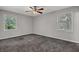 Spacious bedroom with neutral paint, carpet, ceiling fan, and natural light at 3189 Glen Hollow Dr, Rex, GA 30273