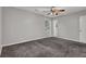 Bedroom features neutral walls, carpet flooring, ceiling fan, closet doors, and window at 3189 Glen Hollow Dr, Rex, GA 30273