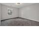 Well-lit bedroom featuring plush carpeting, a window, and soothing paint at 3189 Glen Hollow Dr, Rex, GA 30273
