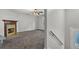 Living room featuring a fireplace, carpeting, neutral paint color and ceiling fan at 3189 Glen Hollow Dr, Rex, GA 30273