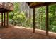 This partially covered backyard offers a peaceful view of the surrounding wooded area at 6750 Blackstone Pl # 6, Mableton, GA 30126