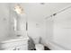 This full bathroom features all-white fixtures including tub and shower, and a large mirror at 6750 Blackstone Pl # 6, Mableton, GA 30126