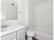 This bathroom is a bright white, with a combination shower and tub at 6750 Blackstone Pl # 6, Mableton, GA 30126