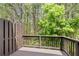 A wooden deck provides a serene outdoor space surrounded by lush greenery and trees at 6750 Blackstone Pl # 6, Mableton, GA 30126
