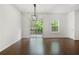 The dining room features hardwood floors, modern lighting, and a walk-out deck at 6750 Blackstone Pl # 6, Mableton, GA 30126