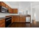 A modern kitchen features stainless steel appliances and hardwood floors at 6750 Blackstone Pl # 6, Mableton, GA 30126