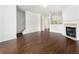 The open living space features dark hardwood floors, fireplace, and ample natural light at 6750 Blackstone Pl # 6, Mableton, GA 30126