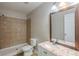 A modern bathroom with a walk-in shower, granite countertops, and vanity at 1808 Arkose Se Dr, Atlanta, GA 30316