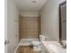 A modern bathroom with a walk-in shower, granite countertops, and vanity at 1808 Arkose Se Dr, Atlanta, GA 30316