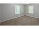 Bedroom with carpet and two windows at 1808 Arkose Se Dr, Atlanta, GA 30316