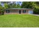 Charming single-story brick home with lush green lawn and attached single car garage at 1808 Arkose Se Dr, Atlanta, GA 30316