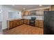 Kitchen featuring granite countertops and stainless steel appliances with views into living room at 1808 Arkose Se Dr, Atlanta, GA 30316