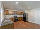 Updated kitchen boasts stainless appliances, granite counters, and wood-look flooring at 1808 Arkose Se Dr, Atlanta, GA 30316
