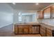 Kitchen featuring granite countertops and stainless steel dishwasher with view into living room at 1808 Arkose Se Dr, Atlanta, GA 30316