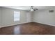 Bright living room featuring new paint, stylish ceiling fan, and beautiful wood-look floors at 1808 Arkose Se Dr, Atlanta, GA 30316