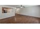 Spacious living room featuring wood-look flooring and view into the kitchen area at 1808 Arkose Se Dr, Atlanta, GA 30316