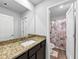 Bathroom featuring granite countertops, new vanity, and floral shower curtain at 201 Kingfisher Walk, Covington, GA 30014