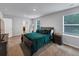 Bright bedroom featuring a queen bed, plush carpet, and a window providing natural light at 201 Kingfisher Walk, Covington, GA 30014