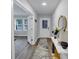 Entryway featuring modern decor, wood floors, and a stylish console table at 201 Kingfisher Walk, Covington, GA 30014