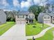 Attractive home with a double garage, green lawn and a well-maintained landscape at 201 Kingfisher Walk, Covington, GA 30014