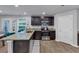Well-equipped kitchen featuring dark cabinets, stainless appliances, and center island at 201 Kingfisher Walk, Covington, GA 30014