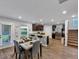 Open concept kitchen and dining area features modern appliances and ample natural light at 201 Kingfisher Walk, Covington, GA 30014