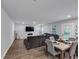 Open living space with a large sectional sofa and a wall-mounted television at 201 Kingfisher Walk, Covington, GA 30014