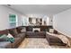 Comfortable living room with a large sectional sofa and an open floor plan at 201 Kingfisher Walk, Covington, GA 30014