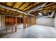 Unfinished basement with exposed wood beams and ductwork offers potential for customization at 2430 Harbin Springs Cv, Dacula, GA 30019