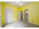 Bright bedroom with carpet floors and yellow painted walls at 2430 Harbin Springs Cv, Dacula, GA 30019