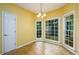 Bright breakfast nook with ample windows and chandelier lighting at 2430 Harbin Springs Cv, Dacula, GA 30019