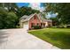 Spacious home with a large driveway, two-car garage and a well-kept lawn at 2430 Harbin Springs Cv, Dacula, GA 30019