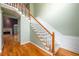 Elegant foyer with staircase, hardwood floors, and view of the living room at 2430 Harbin Springs Cv, Dacula, GA 30019