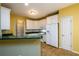 Cozy kitchen with white cabinets, green countertops, and tile flooring at 2430 Harbin Springs Cv, Dacula, GA 30019