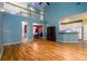 Open-concept living room with views of the dining room and kitchen at 2430 Harbin Springs Cv, Dacula, GA 30019