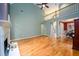Living room featuring fireplace, hardwood floors, and staircase at 2430 Harbin Springs Cv, Dacula, GA 30019
