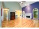 Spacious living room with high ceilings, fireplace, and hardwood floors at 2430 Harbin Springs Cv, Dacula, GA 30019
