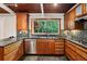Updated kitchen with stainless steel appliances, granite countertops, and tile backsplash at 3539 Eaglerock Dr, Doraville, GA 30340