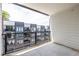 Outdoor balcony with black iron railing and view of neighboring townhomes at 399 Pratt Se Dr # 910, Atlanta, GA 30315