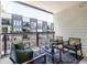 Relaxing balcony with stylish outdoor furniture and great neighborhood views perfect for leisure and entertaining at 399 Pratt Se Dr # 910, Atlanta, GA 30315