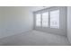 Bright, airy bedroom featuring plush carpeting and large windows, creating a serene and inviting atmosphere at 399 Pratt Se Dr # 910, Atlanta, GA 30315