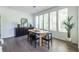 Light-filled dining space with modern furnishings, decor and hardwood flooring at 399 Pratt Se Dr # 910, Atlanta, GA 30315