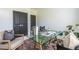 Stylish home office featuring a glass top desk, comfortable chairs, and a vintage rug for a professional yet cozy work environment at 399 Pratt Se Dr # 910, Atlanta, GA 30315