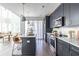 Gourmet kitchen boasting stainless steel appliances, stone countertops, and dark cabinets at 399 Pratt Se Dr # 910, Atlanta, GA 30315