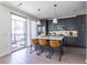 Contemporary kitchen boasts stainless appliances, dark cabinets, and center island with bar stools at 399 Pratt Se Dr # 910, Atlanta, GA 30315