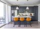 Modern kitchen with stainless steel appliances, center island, and bar stool seating at 399 Pratt Se Dr # 910, Atlanta, GA 30315