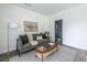 Comfortable living room with modern decor, stylish furnishings, and an adjacent bathroom at 399 Pratt Se Dr # 910, Atlanta, GA 30315