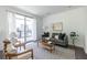 Cozy living room with neutral tones, comfortable seating and sliding doors to a balcony at 399 Pratt Se Dr # 910, Atlanta, GA 30315